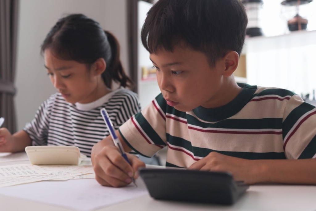 Kids studying inside their modern home