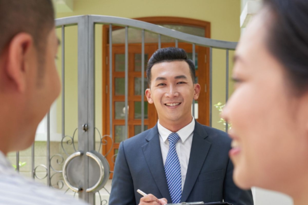 A real estate agent touring an couple at a new home in Luzon